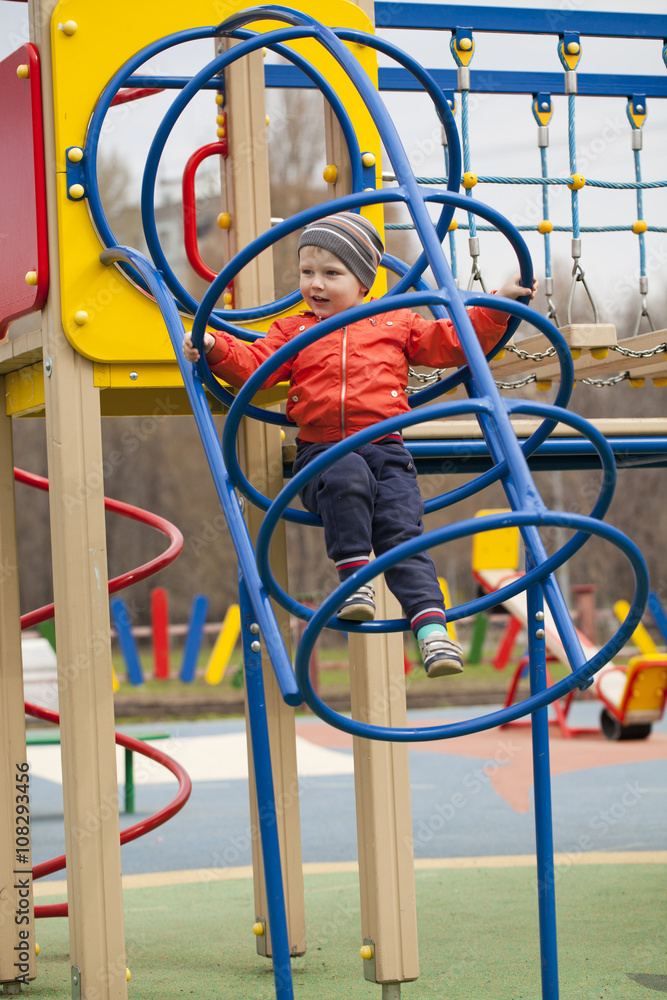 The three-year young boy on the playground The three-year young boy on the playground