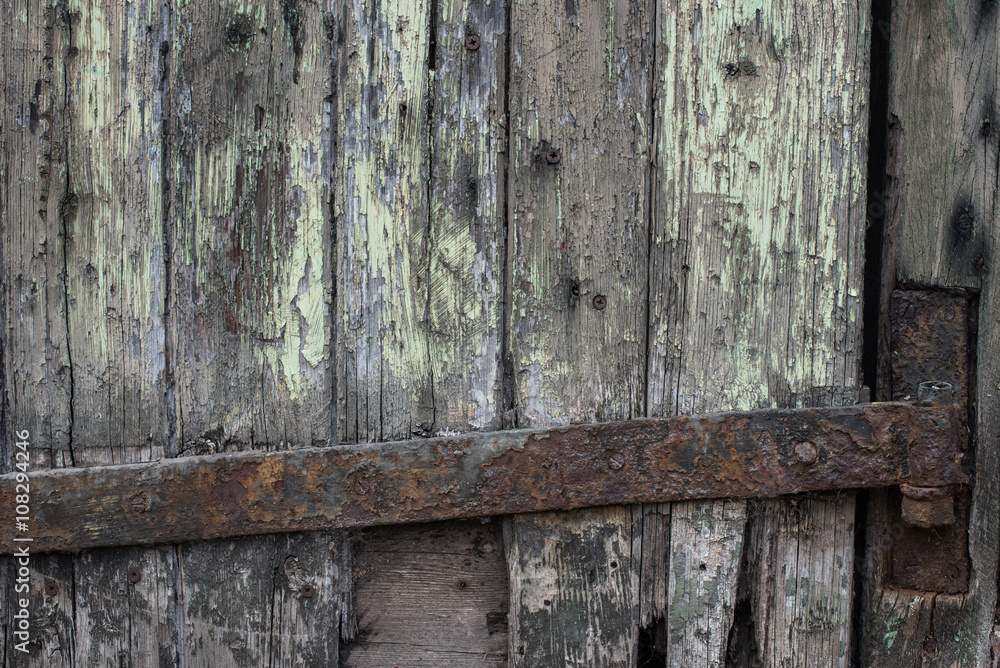 Rusty iron hinge on rotten wood Rusty iron hinge on rotten wood