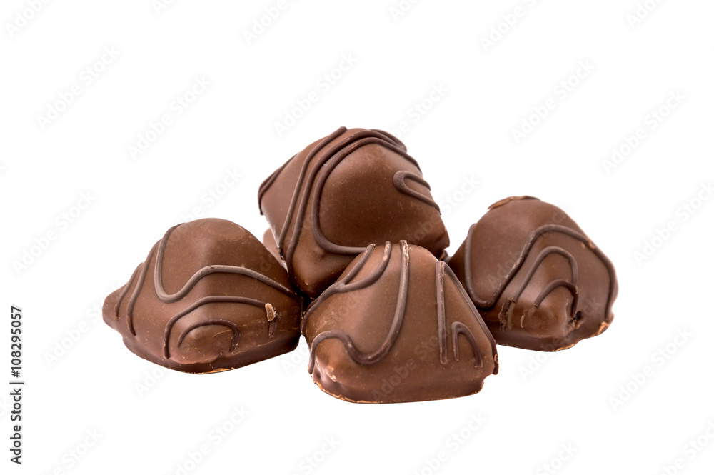 Obraz premium Heap of chocolate candies isolated on white