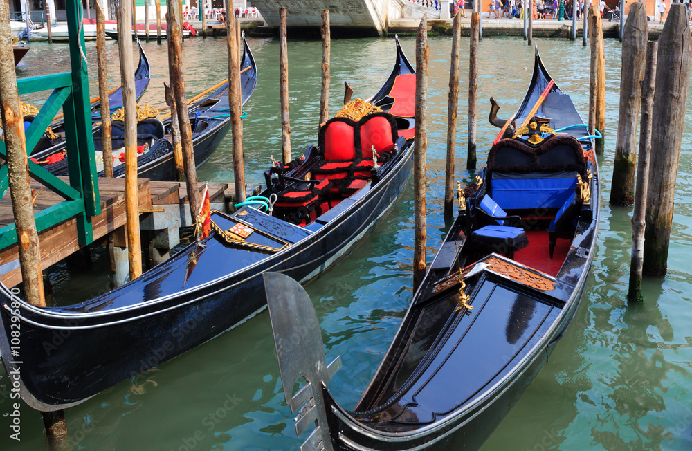venetian gondolas in canal of Venice