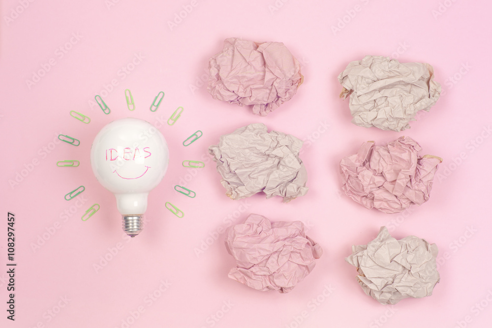 great idea concept with crumpled colorful paper and light bulb on light background. Creative brainstorm concept business idea