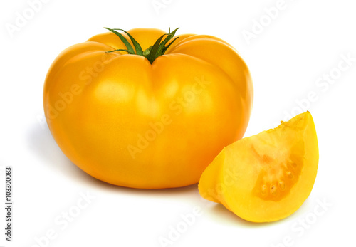 Big fresh yellow tomato isolated on white background.