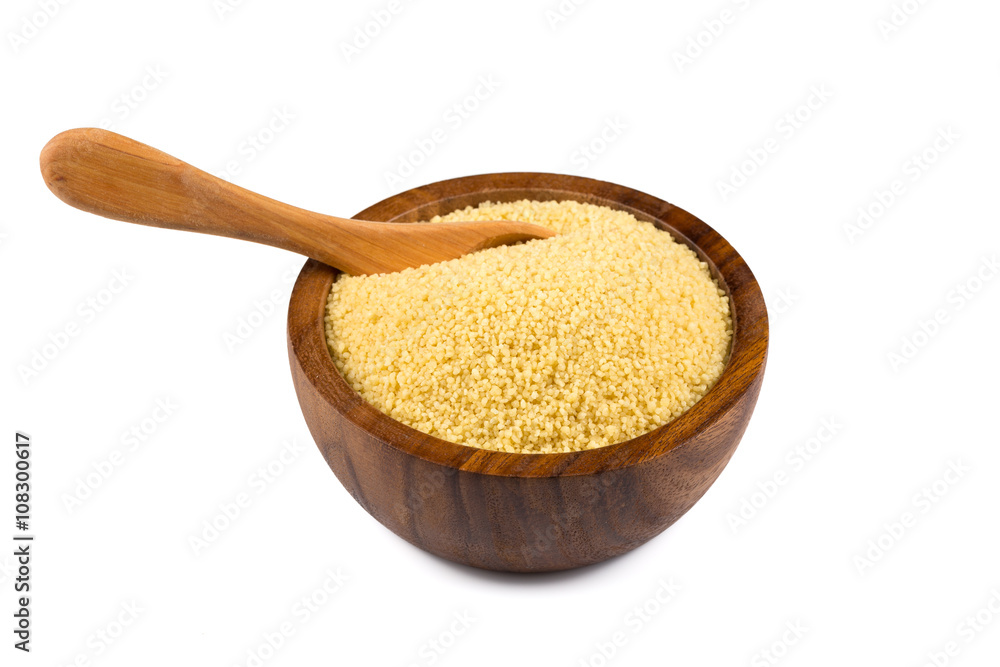 Raw couscous in a wooden bowl Raw couscous in a wooden bowl