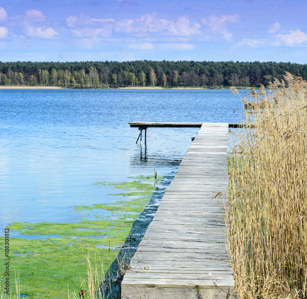 Fototapeta premium Pier on the lake during spring