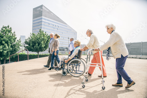 Senior people walking outdoors
