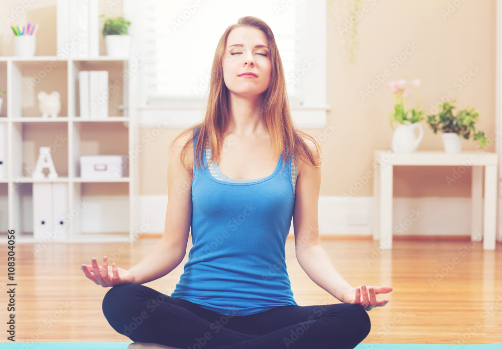 Young woman practicing meditation Young woman practicing meditation