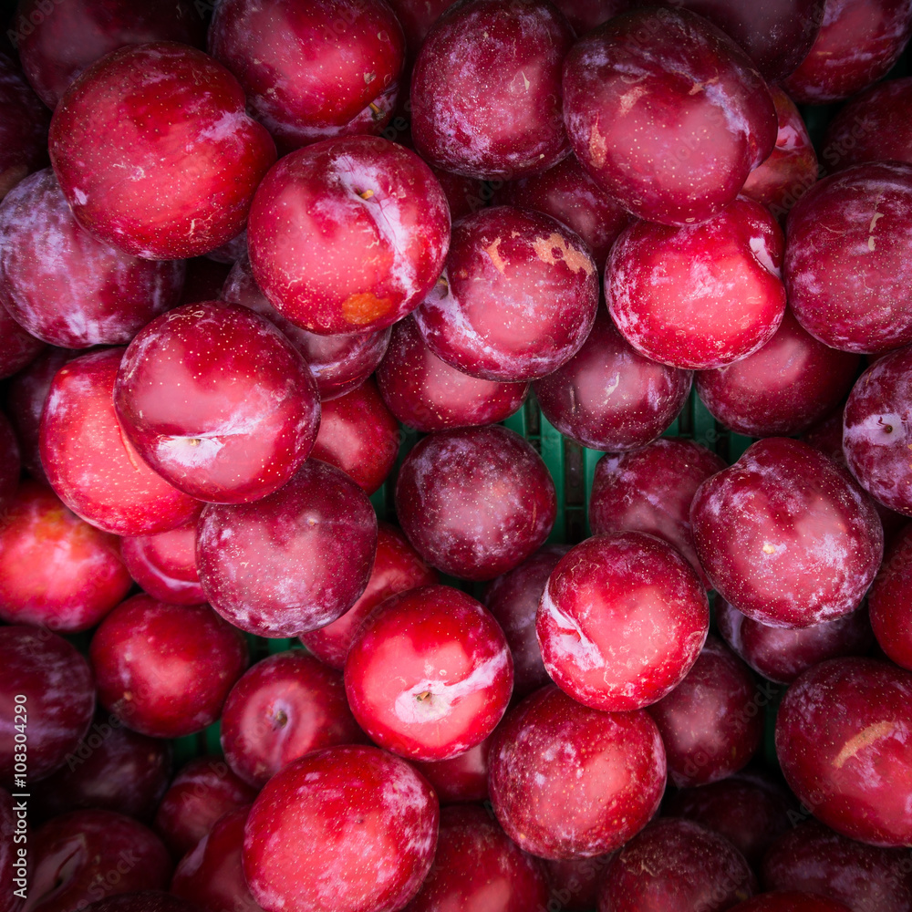 Ripe Plums Background. Fresh ripe red plums Ripe Plums Background. Fresh ripe red plums