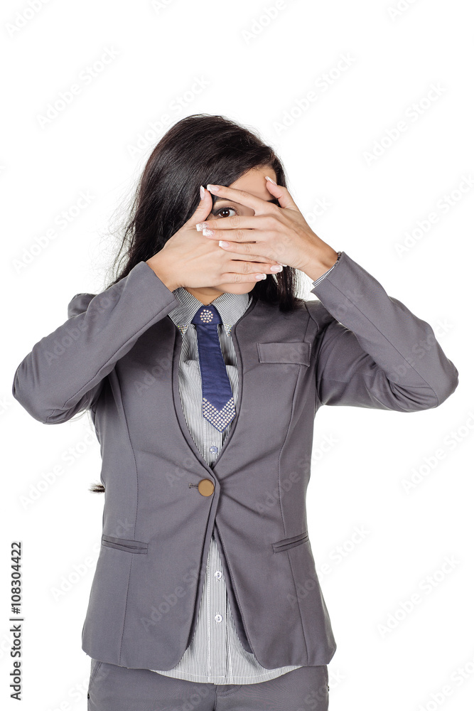 portrait of young business woman in gray suit covering her eyes with her hand. isolated on white background. business and lifestyle concept portrait of young business woman in gray suit covering her eyes with her hand. isolated on white background. business and lifestyle concept