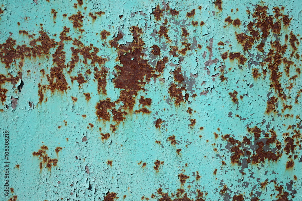  rusted on the cyan green metal wall . background and texture for your design.