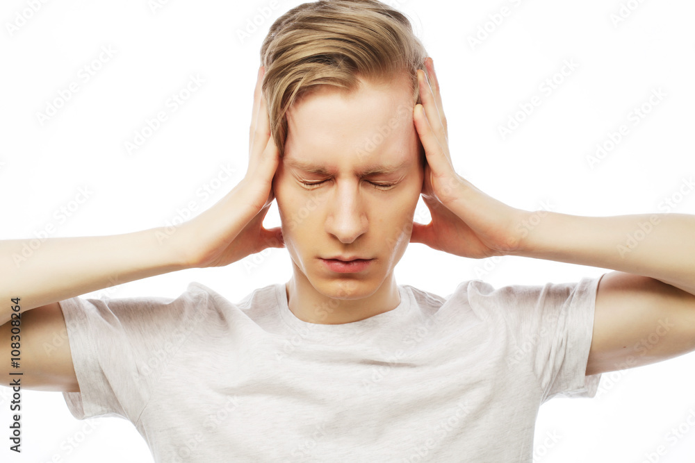 man hold hands on temples ears man hold hands on temples ears