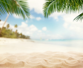 Summer sandy beach with blur ocean on background