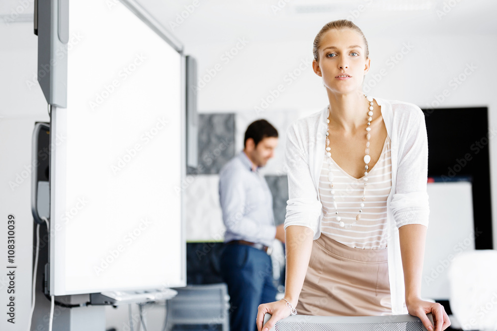 Attractive female worker in office Attractive female worker in office