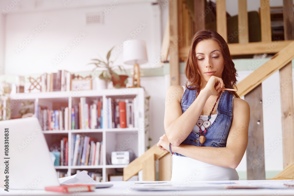 Young woman standing in creative office Young woman standing in creative office
