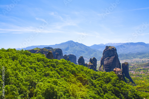 Meteora, Greece. Mountain scenery with Meteora rocks, landscape place of monasteries on the rock, orthodox religious greek landmark in Thessaly. Beautiful  landscape in summer day.