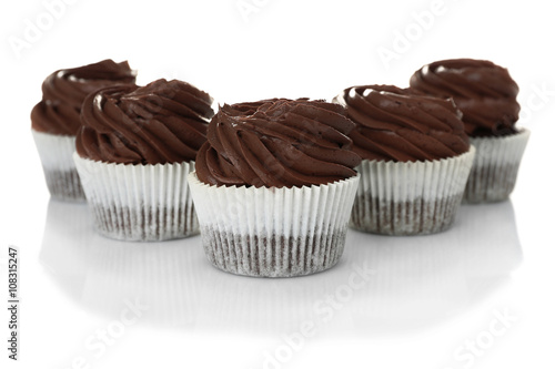 Five chocolate cupcakes, isolated on white