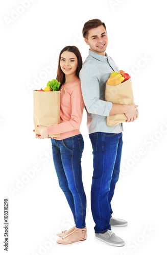 Young couple with paper bag...