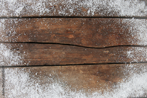 Snowy brown wooden background