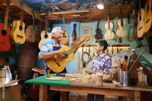 Old Man Grandpa Teaching Boy Grandchild Playing Guitar
