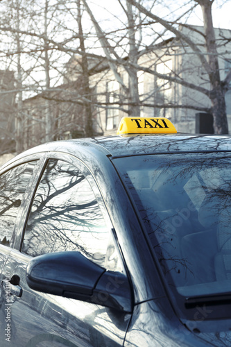 Taxi sign on car outdoor, closeup