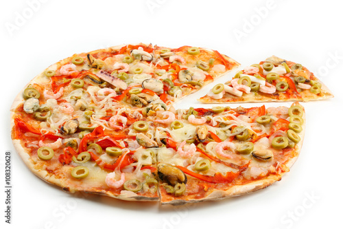 Sliced pizza with seafood, red pepper and green olives, isolated on white