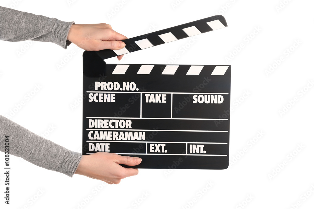 Female hands holding movie clapper isolated on white