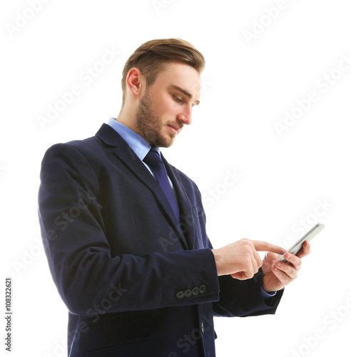 Young man in suit using mob...
