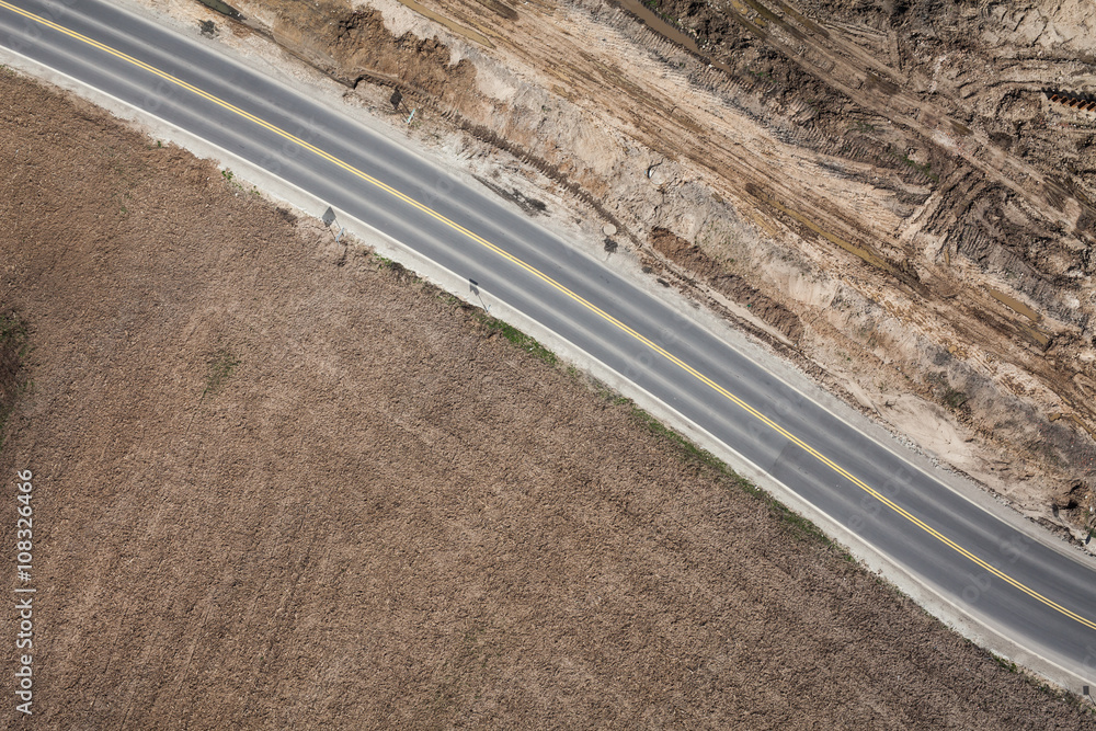 aerial view of  over the  road and harvest fields