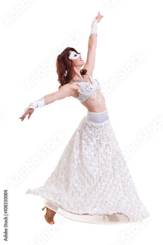 Carnival dancer girl wearing a mask dancing, isolated on white © StepStock
