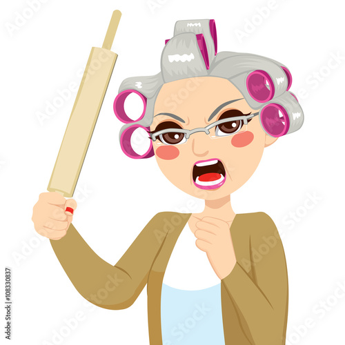 Senior woman angry holding roll pin with aggressive expression screaming