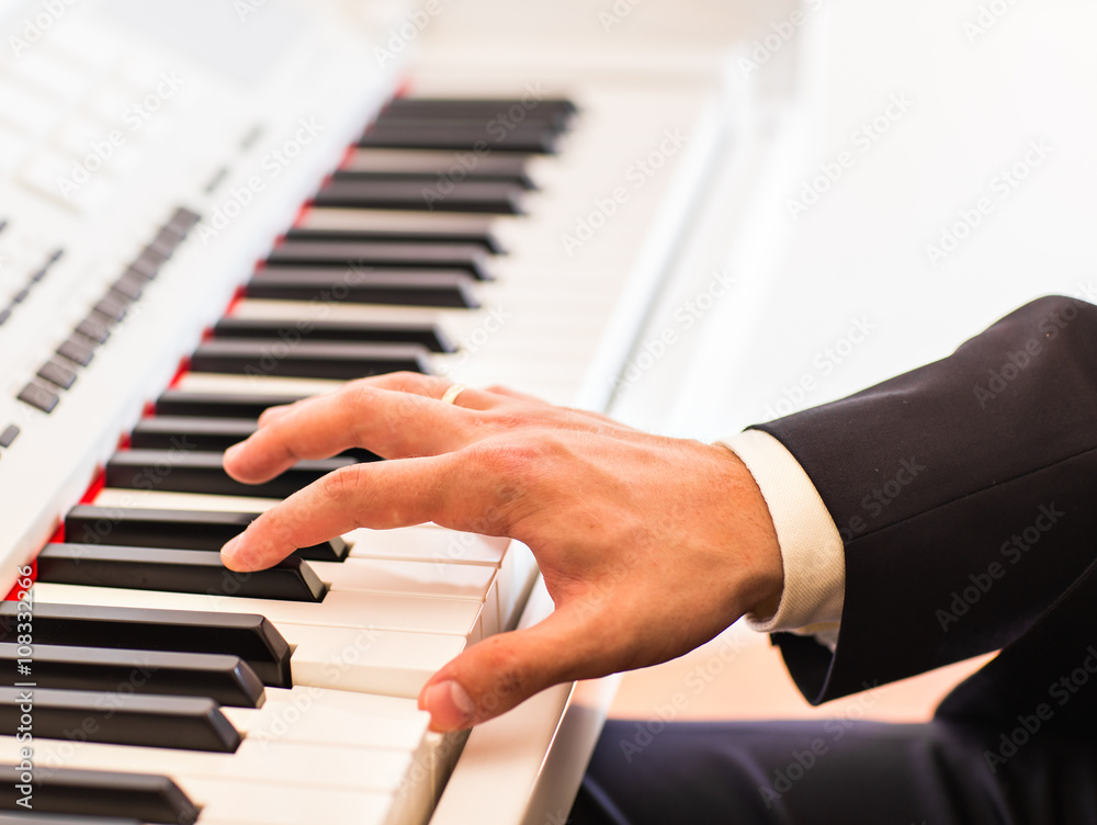 Hands of musician close-up. Pianist playing on electric piano Hands of musician close-up. Pianist playing on electric piano