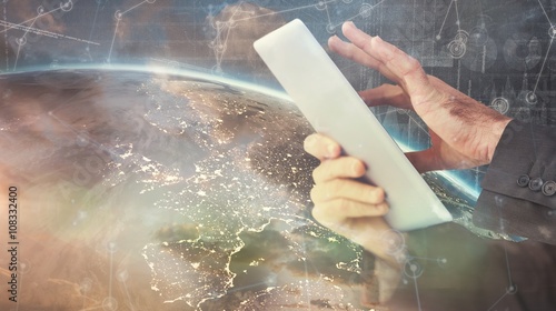 Wallpaper Mural Composite image of businessman scrolling on his digital tablet Torontodigital.ca