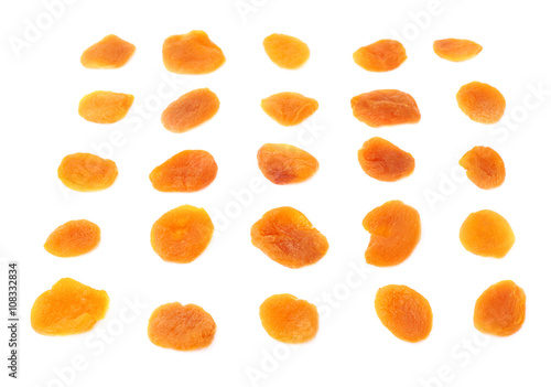 Dried orange apricots over white background