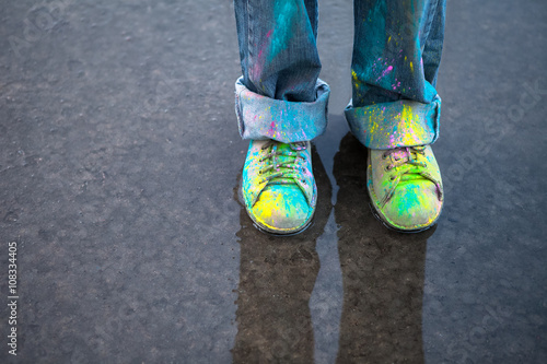 Colorful shoes on puddle photo