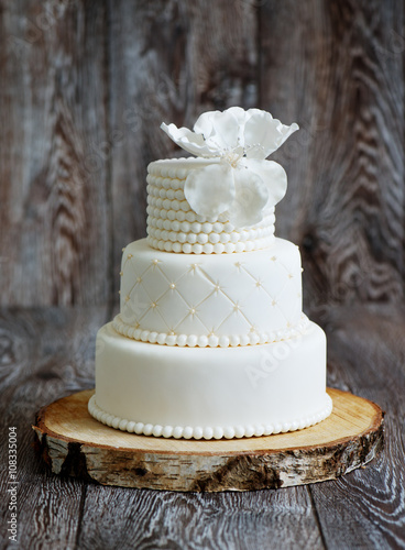 Wedding cake covered with white fondant
