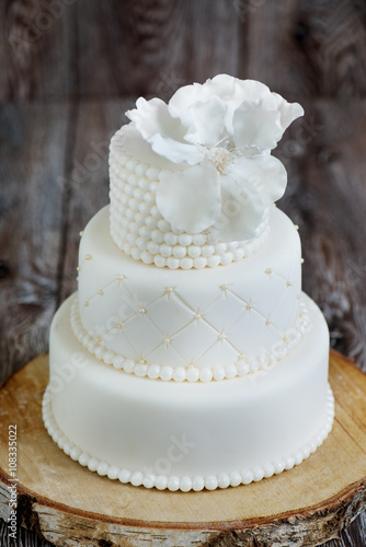 Wedding cake covered with white fondant