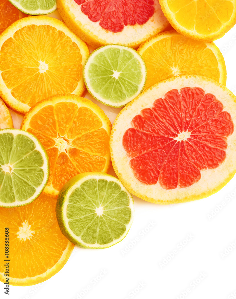 Obraz premium Surface covered with citrus sliced fruits over white isolated background