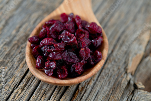 cranberry on wooden surface