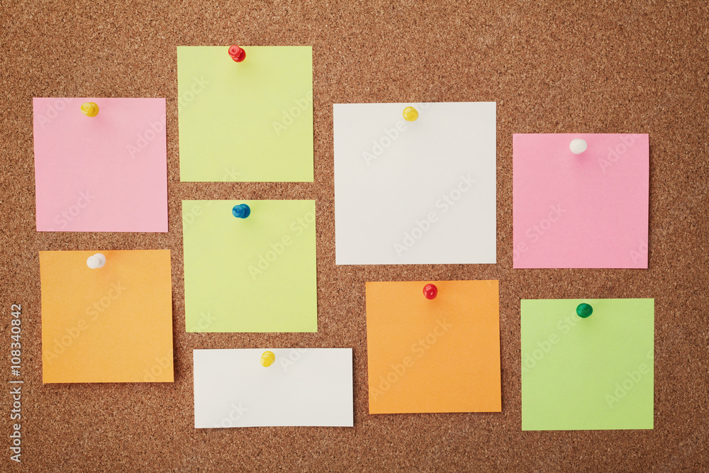 Cork board with notes and pins Cork board with notes and pins