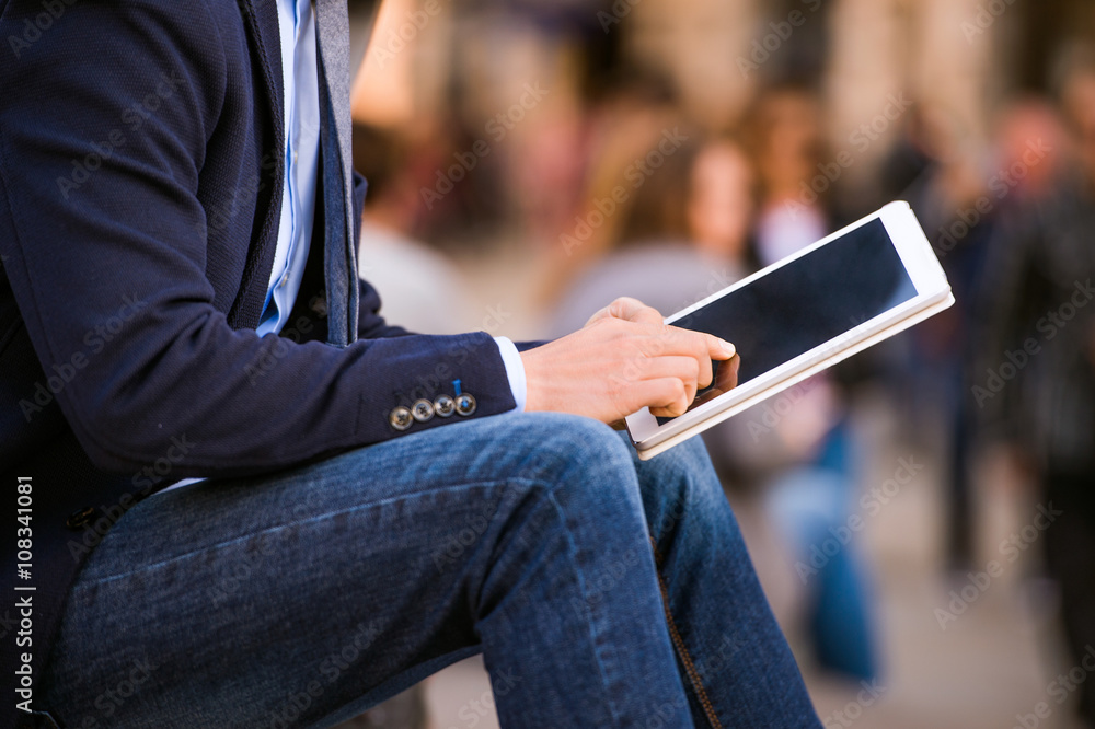 Hipster manager with tablet, Piccadilly Circus, London Hipster manager with tablet, Piccadilly Circus, London