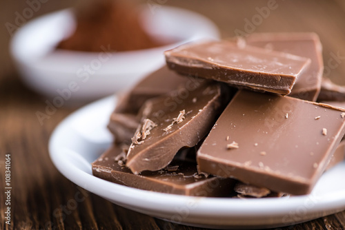Milk Chocolate on wooden background photo
