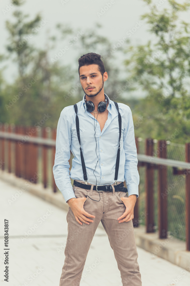 Young handsome man posing in an urban context Young handsome man posing in an urban context