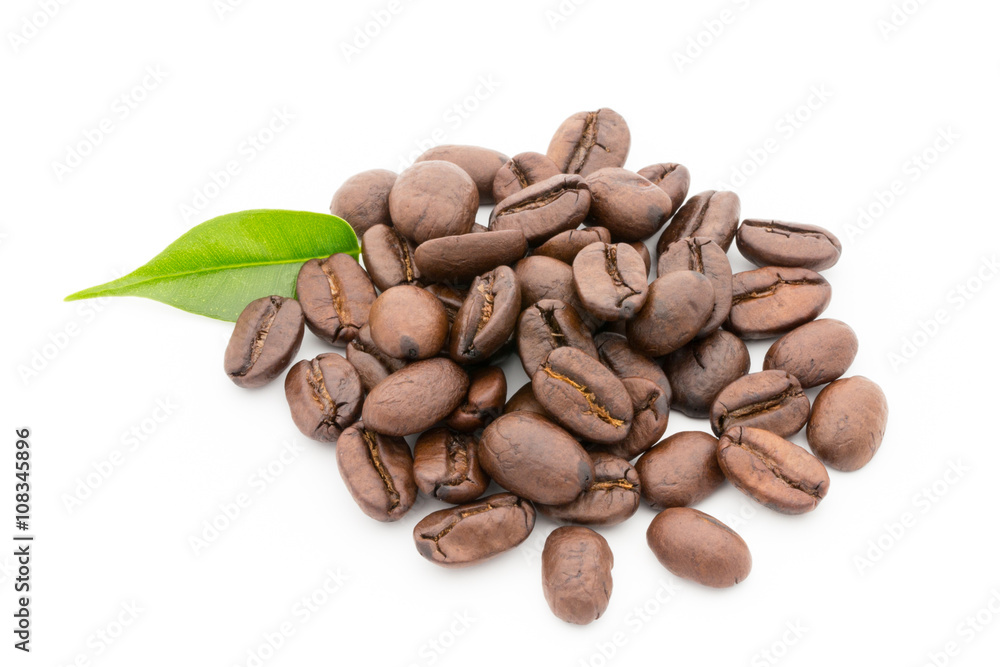 Coffee grains and leaves isolated on the white backgrounds. Coffee grains and leaves isolated on the white backgrounds.