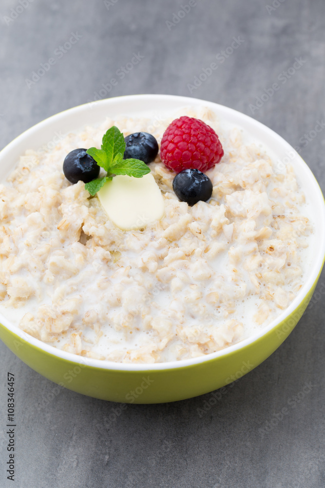 Oatmeal porridge in bowl with berries raspberries and blackberri Oatmeal porridge in bowl with berries raspberries and blackberri
