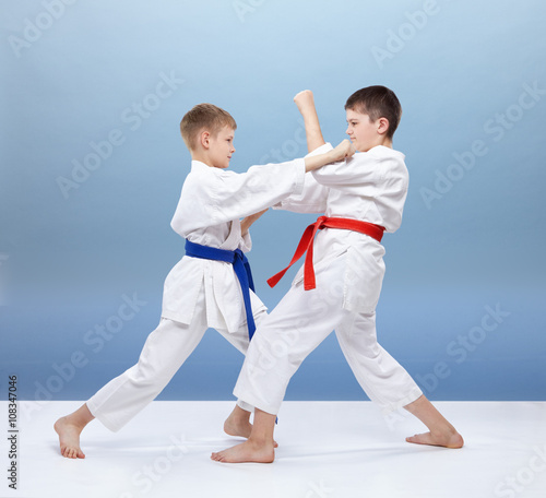 Boys are trained blocks and punches in karategi