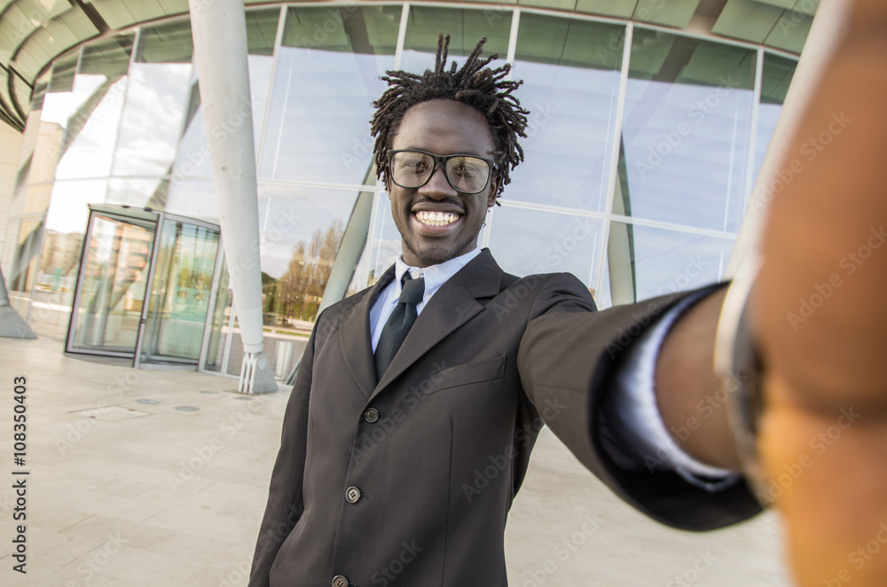 Black young attractive businessman taking a selfie Black young attractive businessman taking a selfie