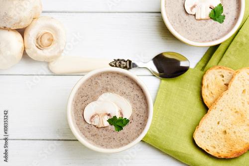 Mushroom ceam soup with bread photo