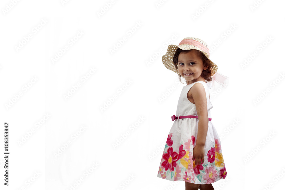 Girl wearing a summer dress and a hat isolated on white background