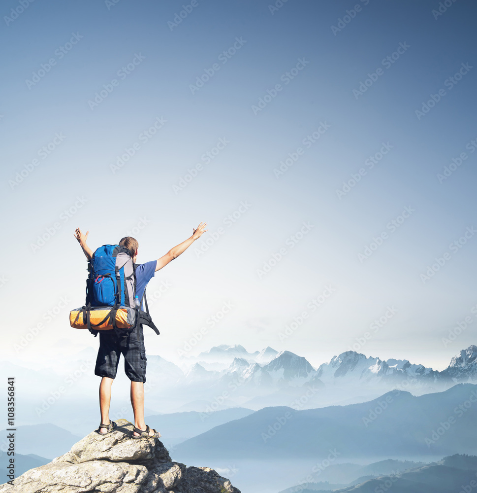 Tourist on mountain peak. Sport and active life concept Tourist on mountain peak. Sport and active life concept