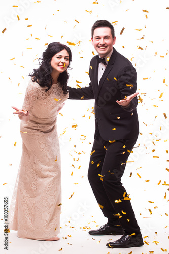 The Showman and showwoman. Young elegant man and woman holding microphone against white background. Showman concept.