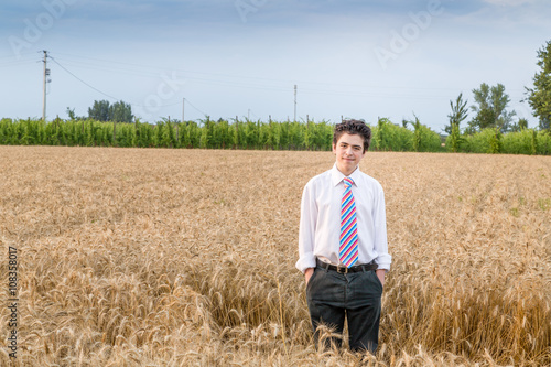 Nice boy in a golden wheat field © Vivida Photo PC